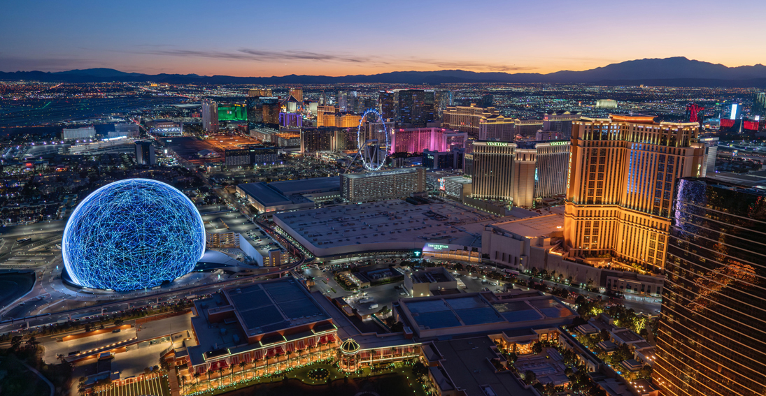 An impressive panoramic shot from above, showcasing the Sphere and other iconic attractions on the Las Vegas Strip