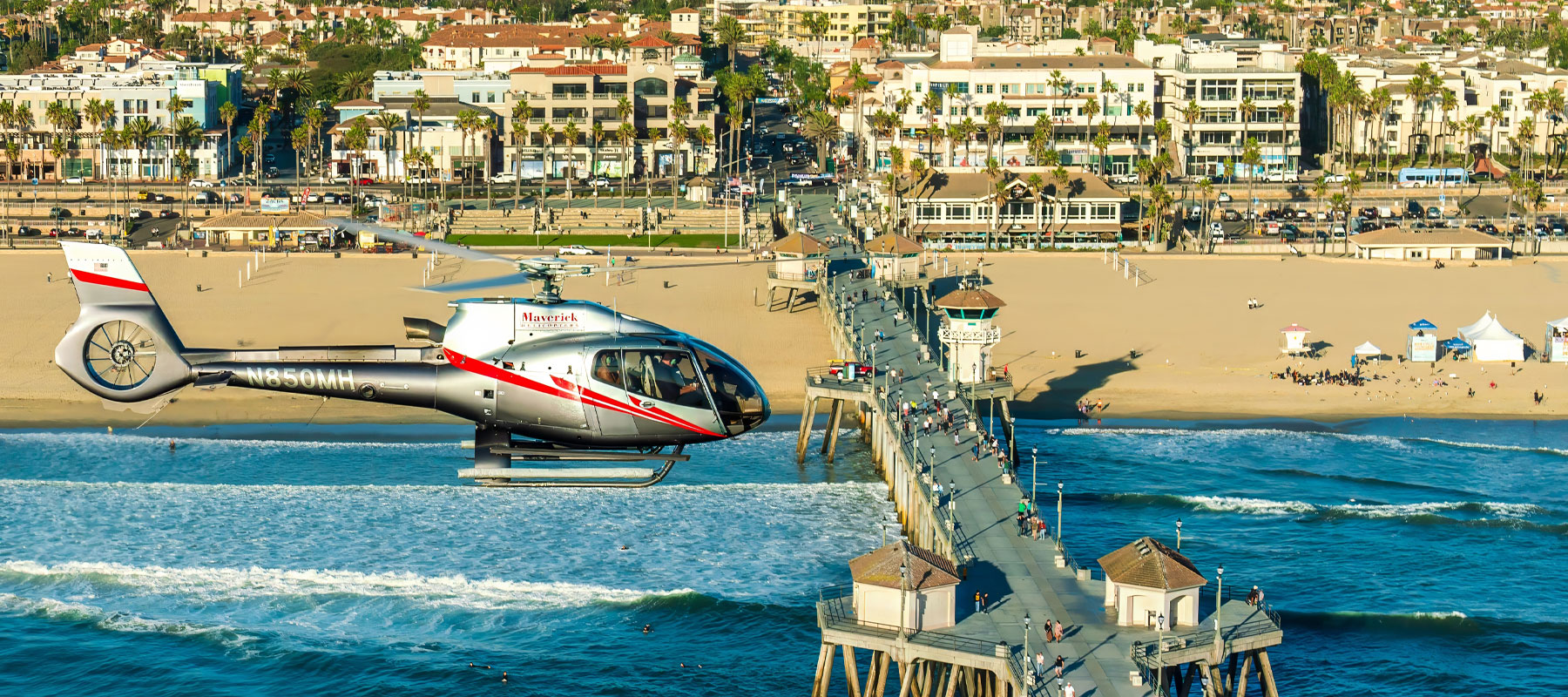 Maverick Helicopters flight over the Huntington Beach Pier