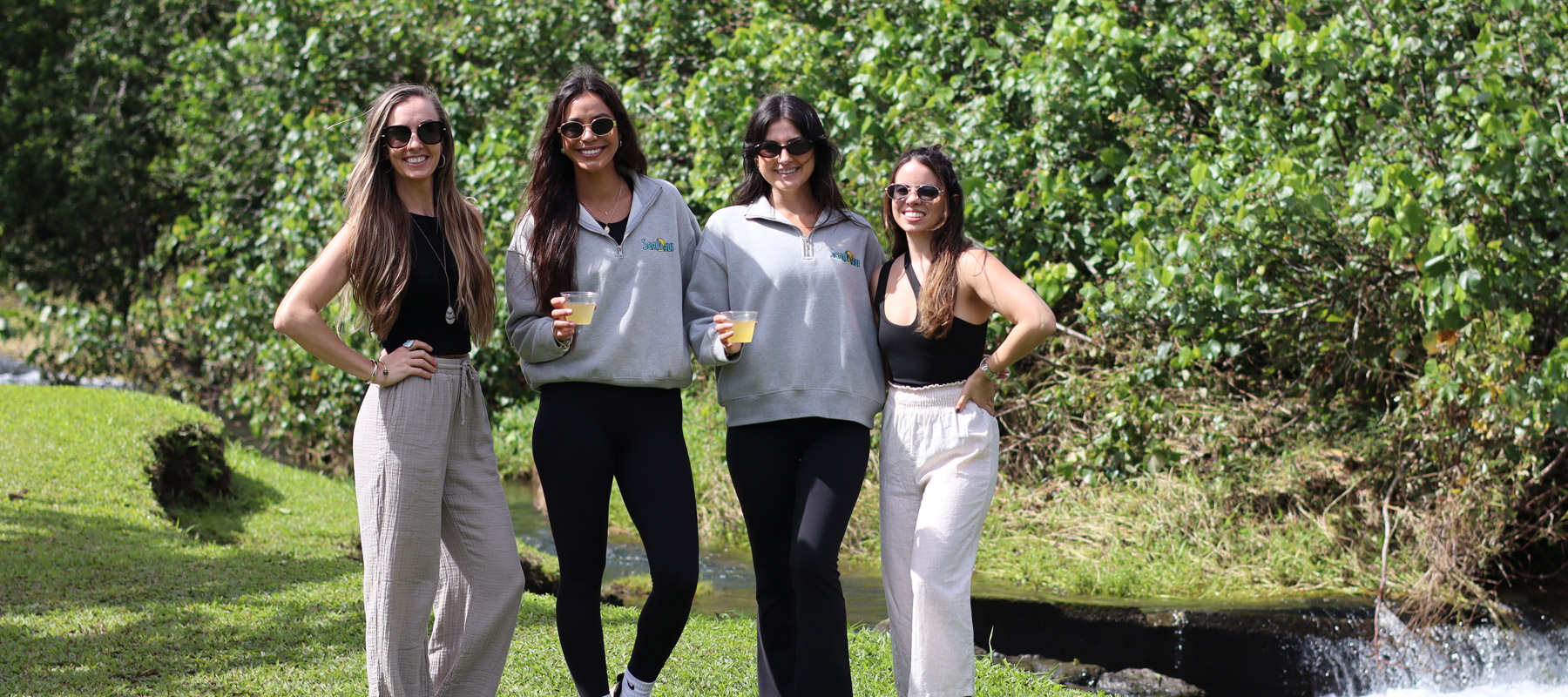 Guests enjoying champagne at the secluded Hana Rainforest landing area on Maui