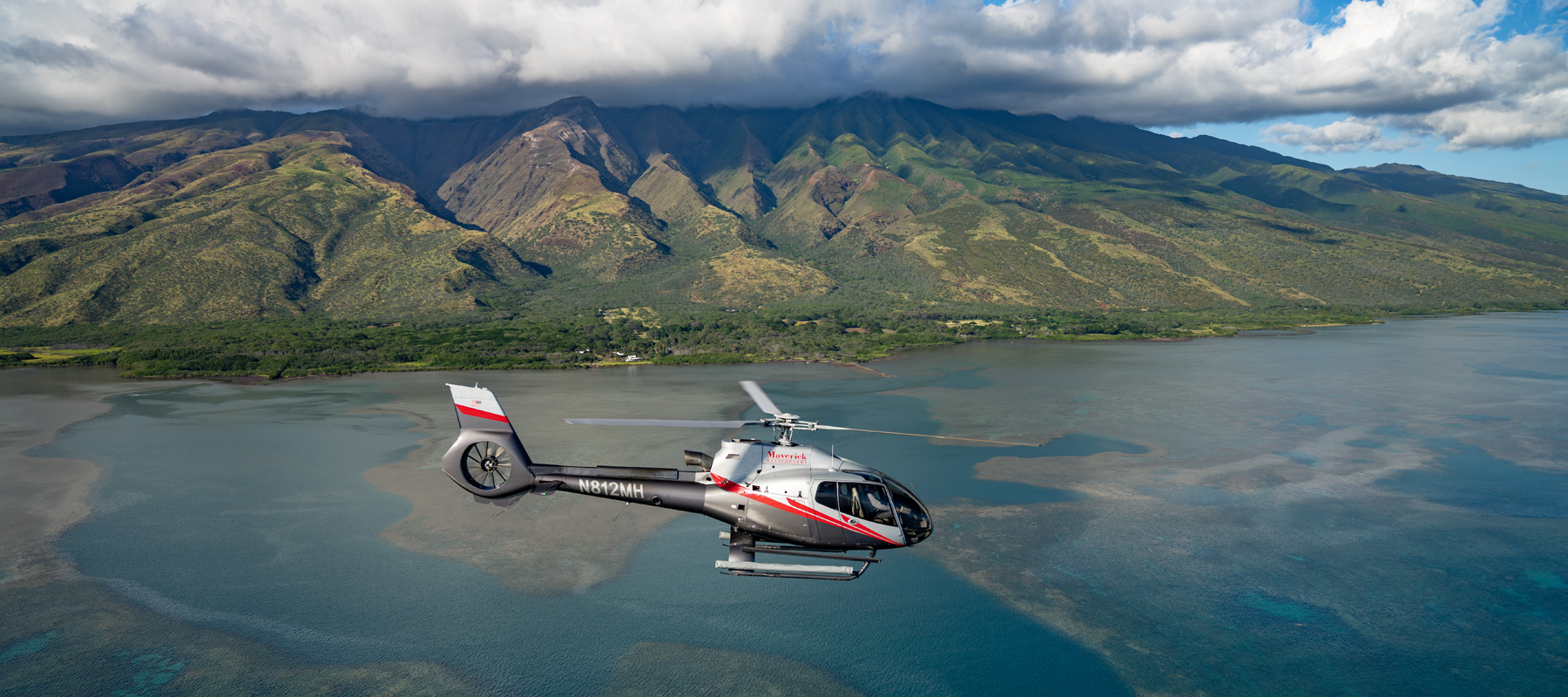 Maverick Helicopter flying over the scenic coastline of Molokai